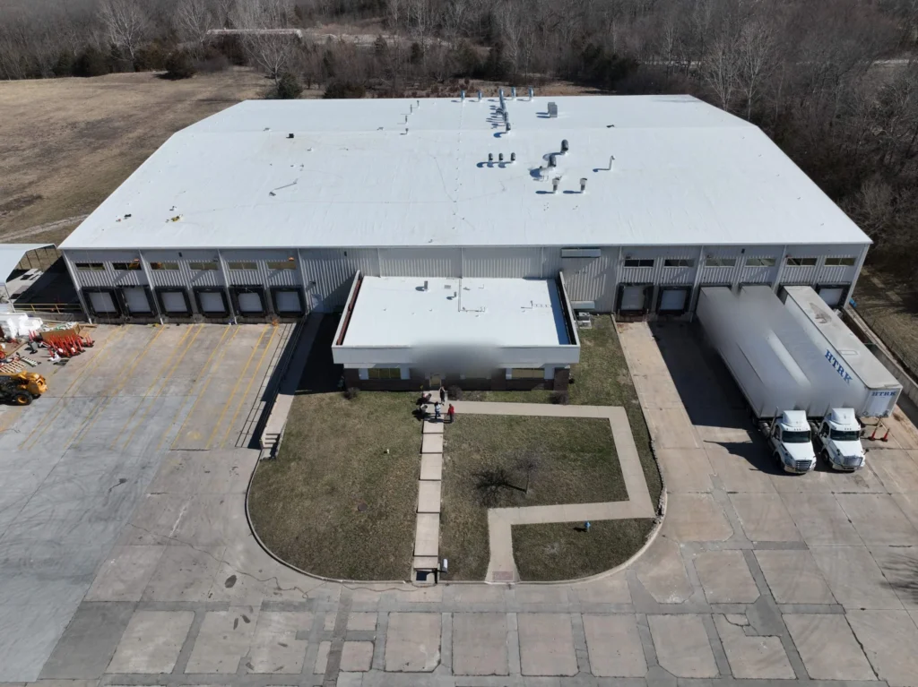Front aerial view of a healthcare laundry facility after a metal roof retrofit